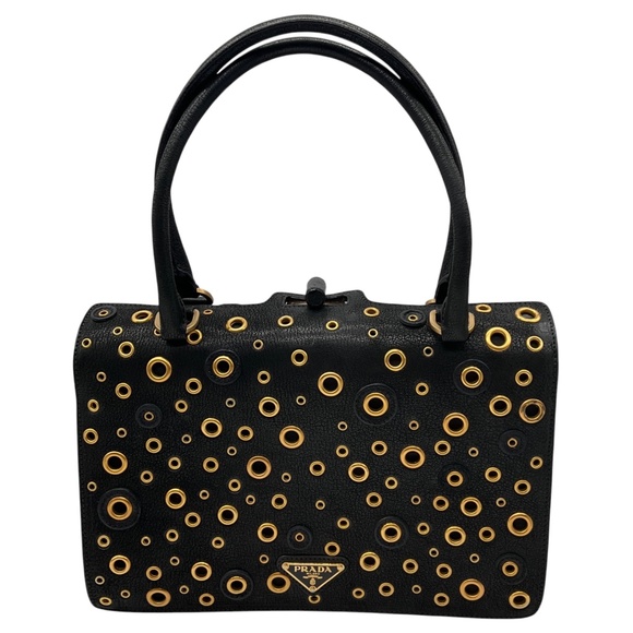 PRADA BLACK / GOLD GROMMET EMBELLISHED LOGO PLAQUE GRAINED LEATHER HANDBAG - Picture 1 of 13